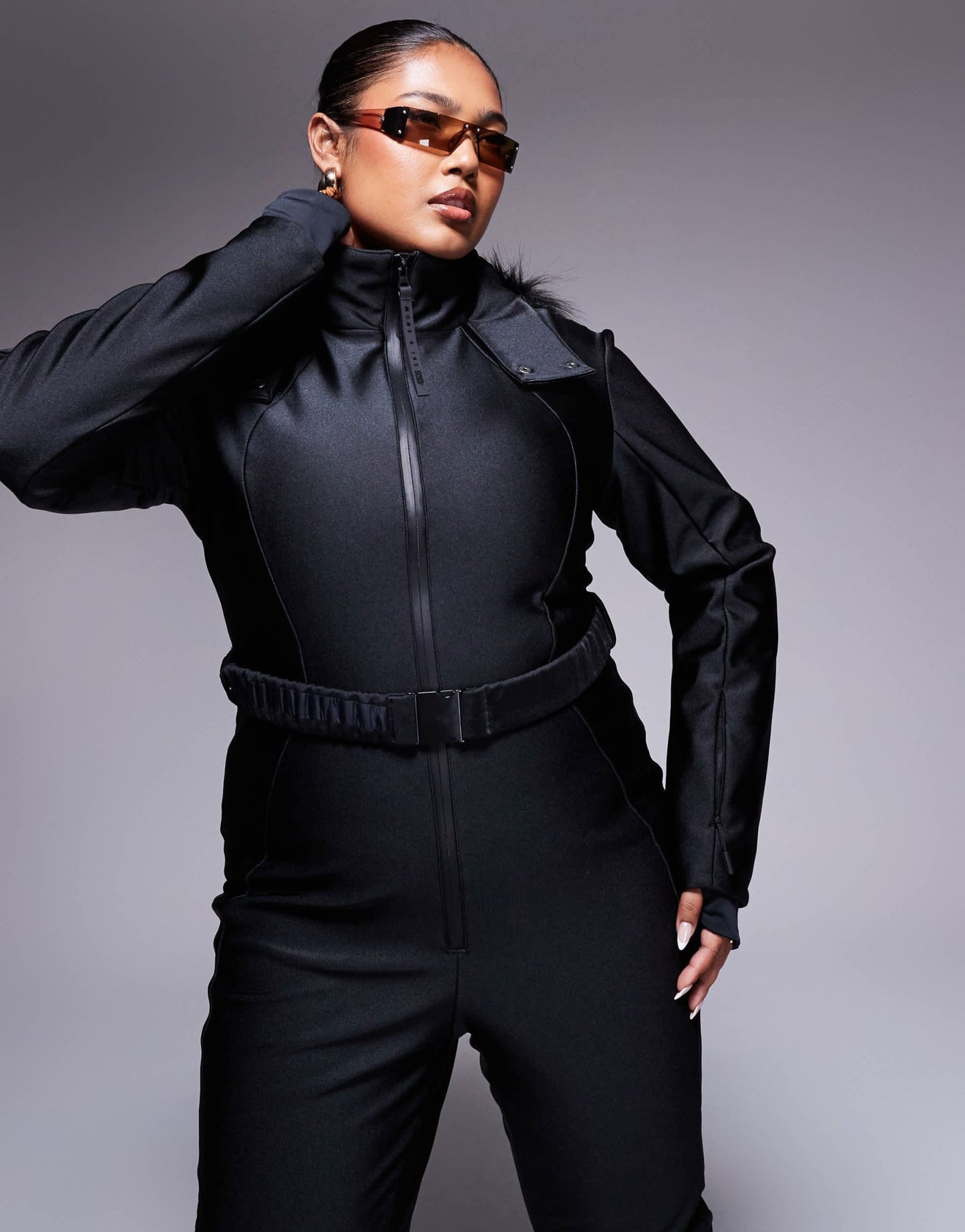 4505 Curve Ski belted ski suit with slim kick leg and faux fur hood in black gloss - ASOS Sample Sale EU Store