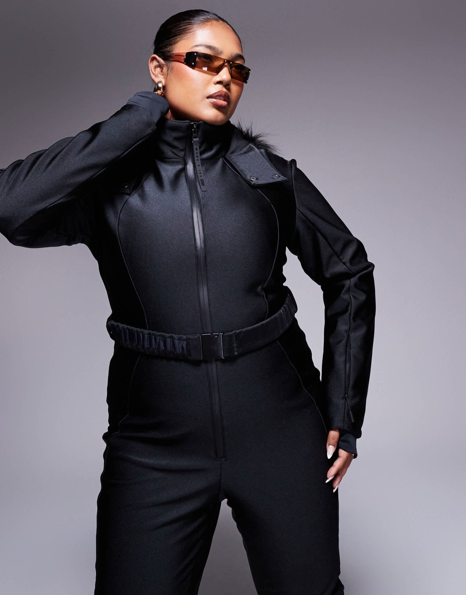 4505 Curve Ski belted ski suit with slim kick leg and faux fur hood in black gloss - ASOS Sample Sale EU Store