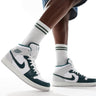 Air Jordan 1 mid trainers in white, grey and dark green