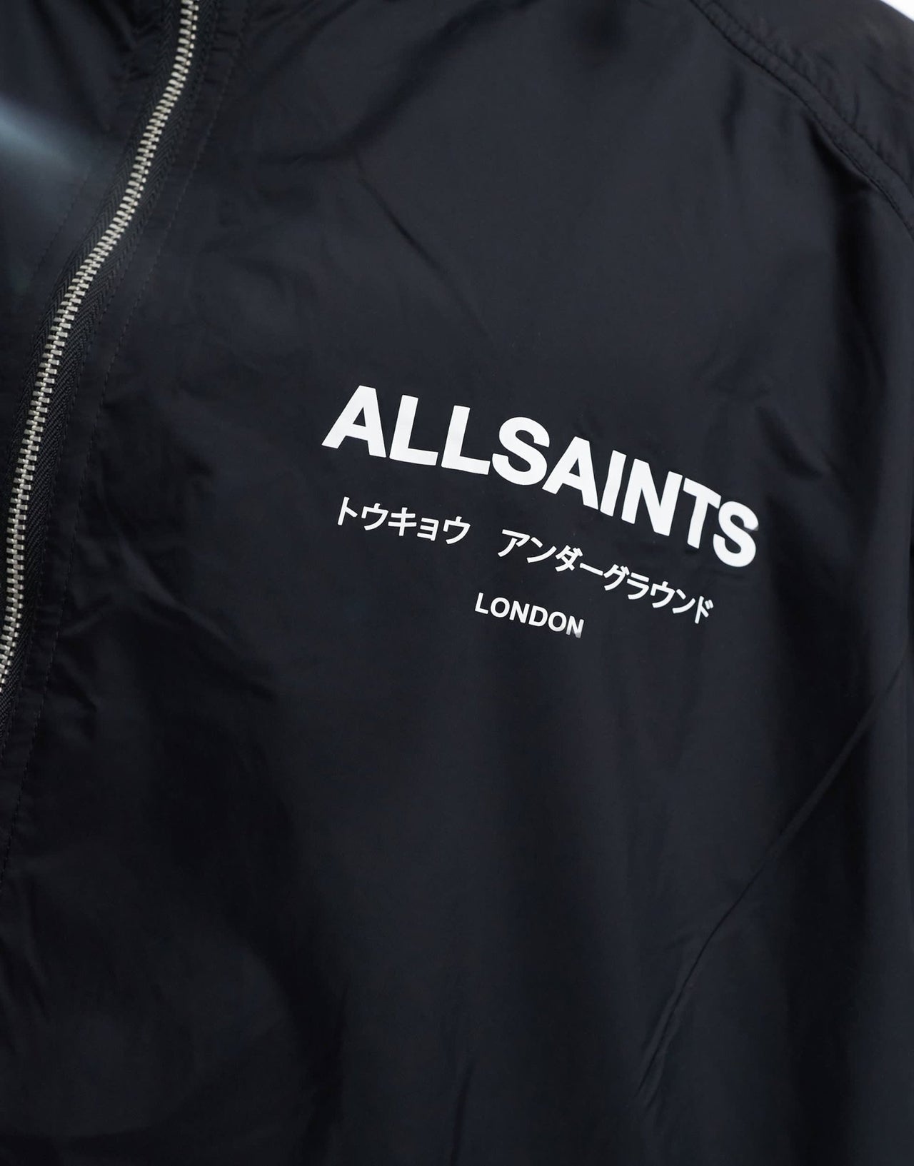 AllSaints Underground unisex lightweight jacket with water resistant finish in black - ASOS Sample Sale EU Store