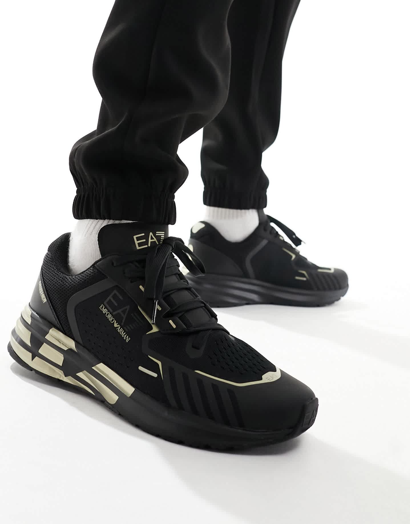 Armani EA7 gold logo flyknit nylon mesh trainer in triple black/gold - ASOS Sample Sale EU Store