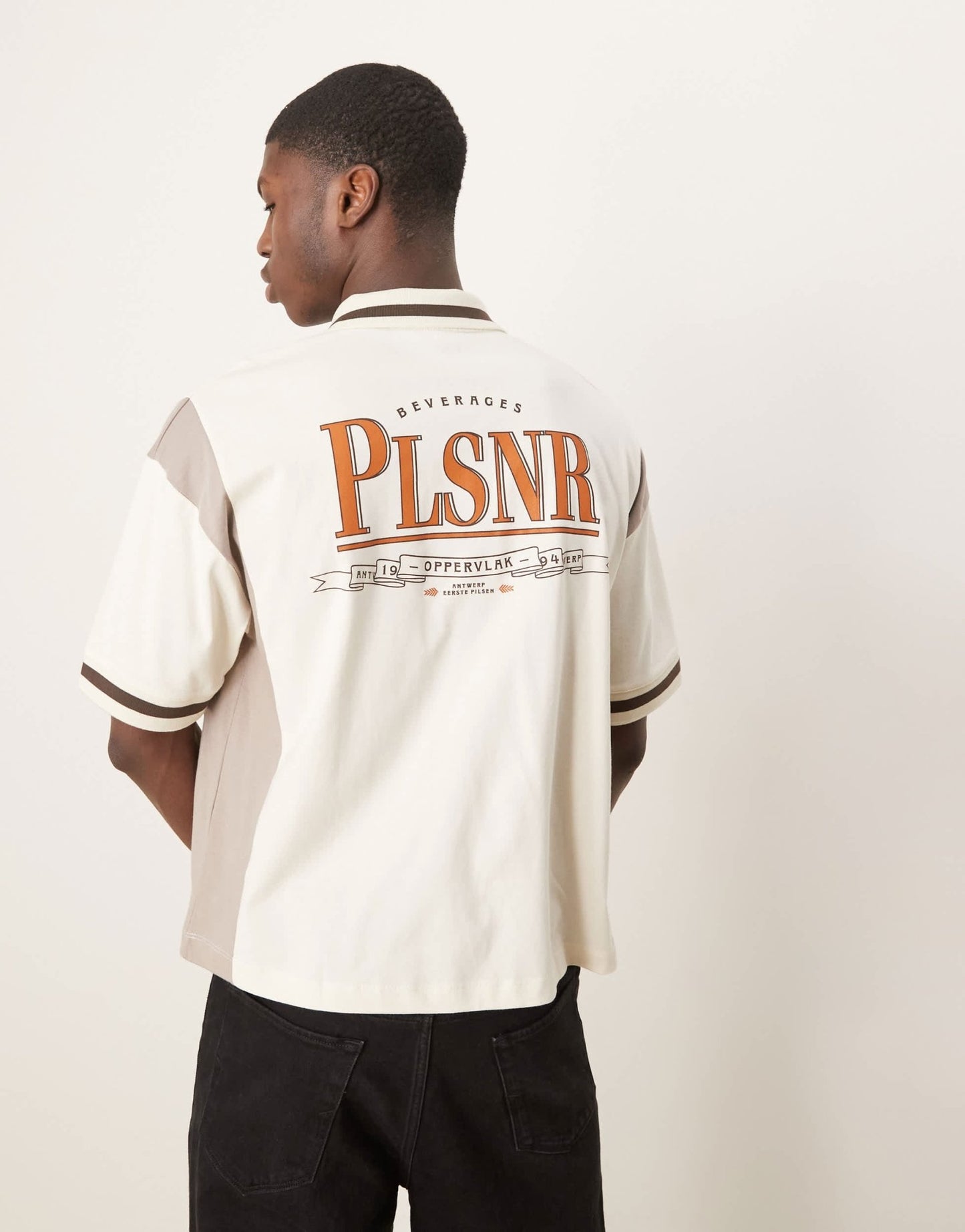 ASOS DESIGN boxy oversized zipped polo with cut and sew panelling and text graphic in cream - ASOS Sample Sale EU Store