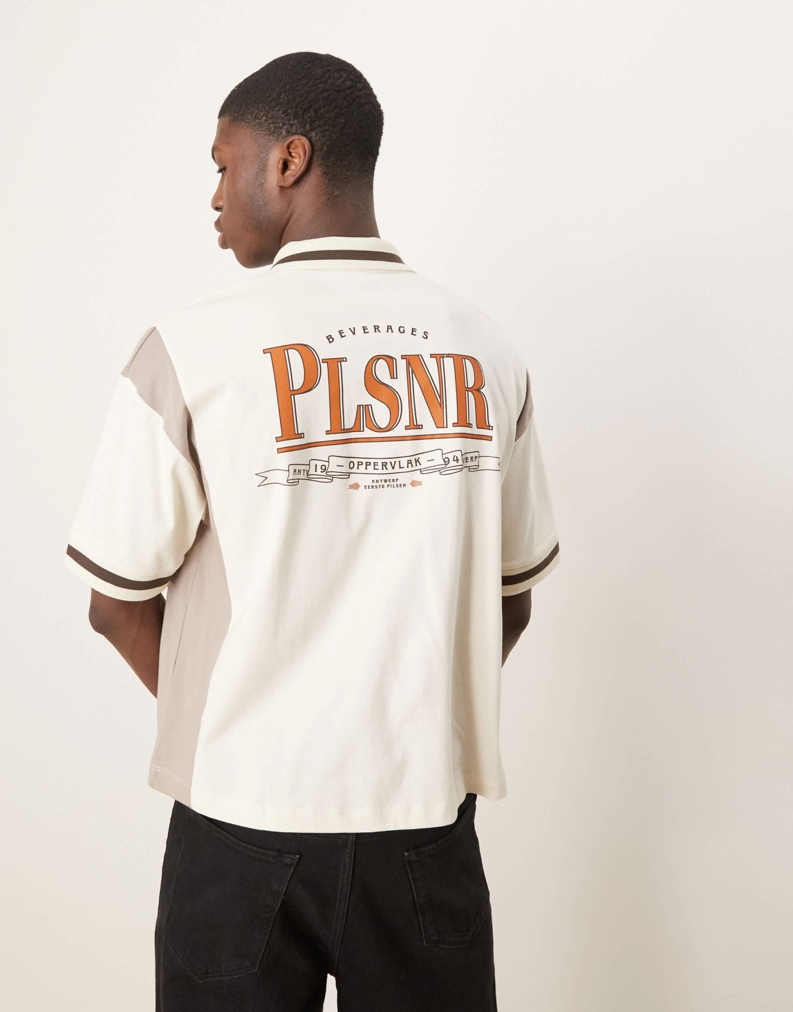 ASOS DESIGN boxy oversized zipped polo with cut and sew panelling and text graphic in cream - ASOS Sample Sale EU Store