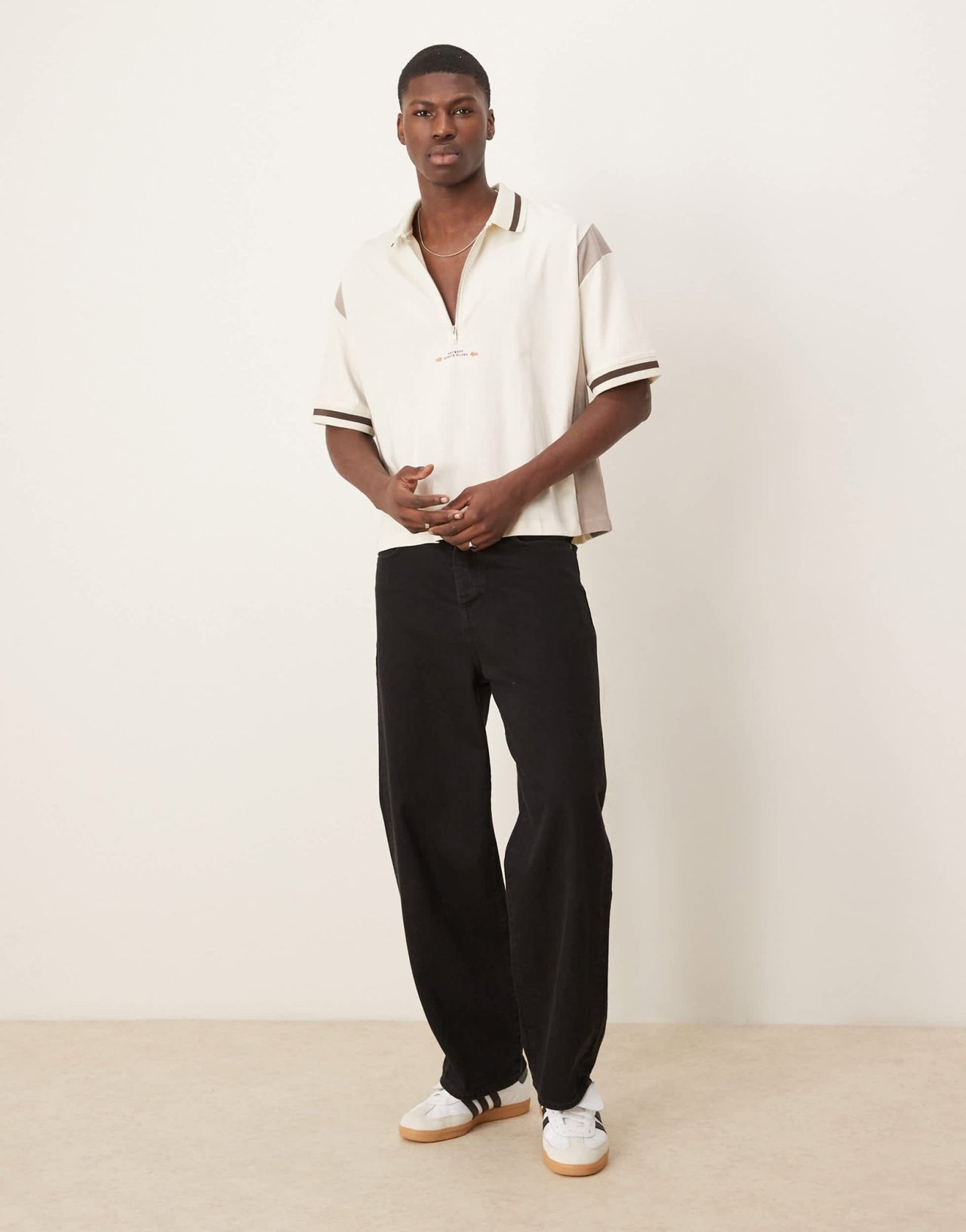 ASOS DESIGN boxy oversized zipped polo with cut and sew panelling and text graphic in cream - ASOS Sample Sale EU Store