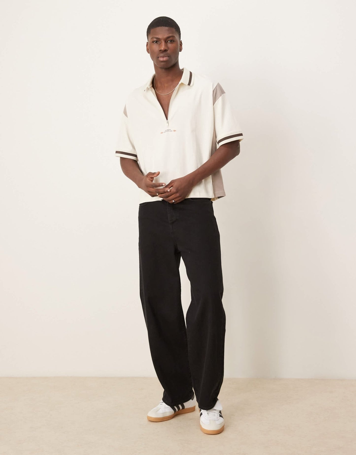 ASOS DESIGN boxy oversized zipped polo with cut and sew panelling and text graphic in cream - ASOS Sample Sale EU Store