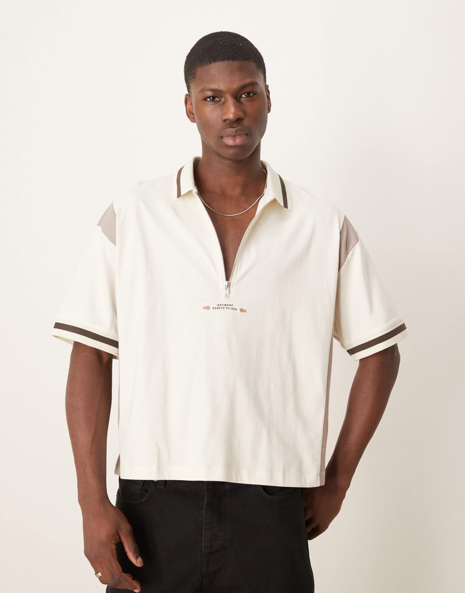 ASOS DESIGN boxy oversized zipped polo with cut and sew panelling and text graphic in cream - ASOS Sample Sale EU Store