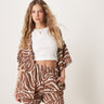 Shorts de tela de queso con detalle sin rematar a juego en estampado de cebra ASOS DESIGN