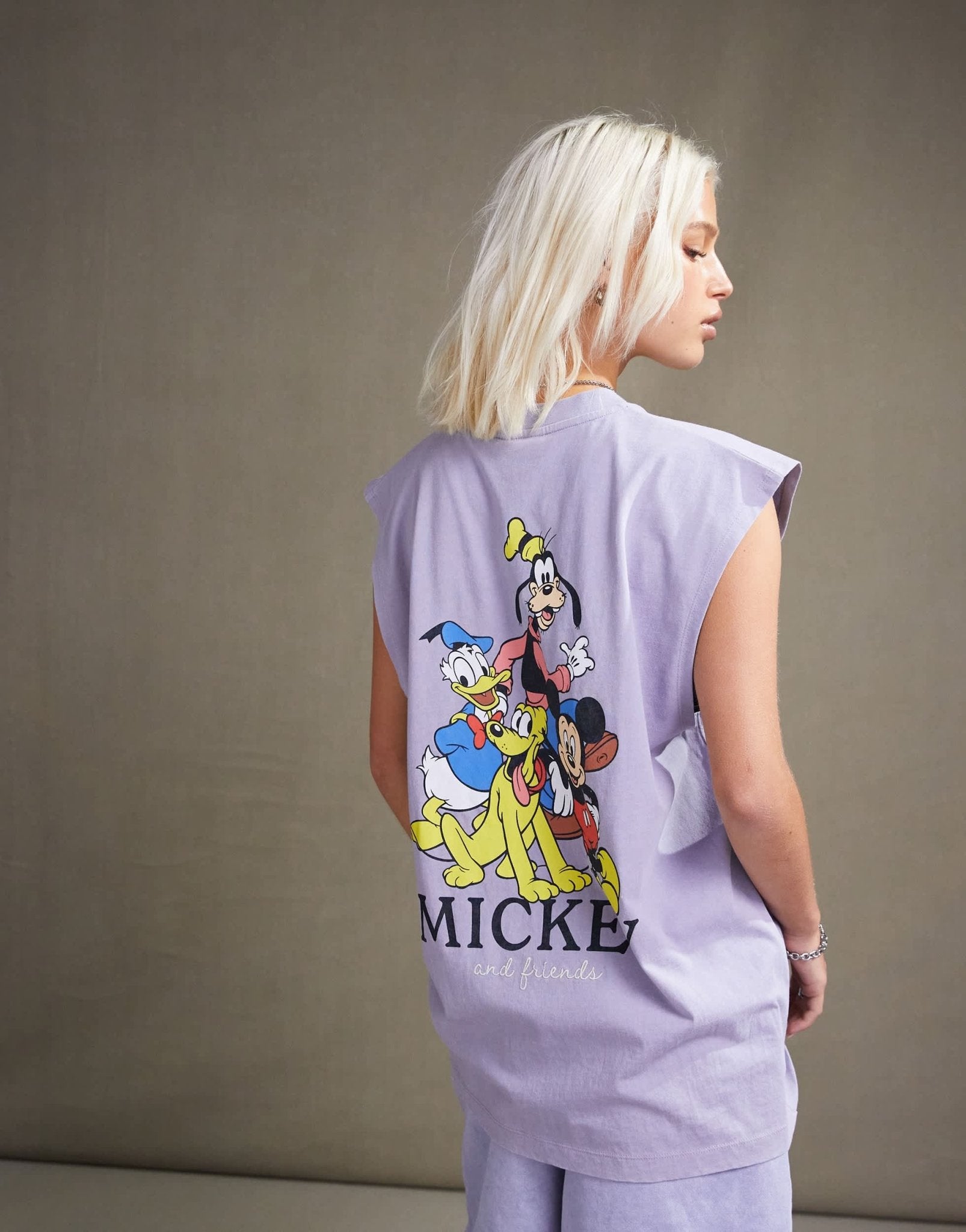 ASOS DESIGN Disney unisex oversized vest with Mickey Mouse & Friends prints in washed purple - ASOS Sample Sale EU Store