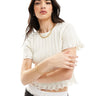 T-shirt baby in maglia a costine ASOS DESIGN in crema