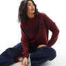 ASOS DESIGN knitted jumper with Après Ski intarsia in burgundy