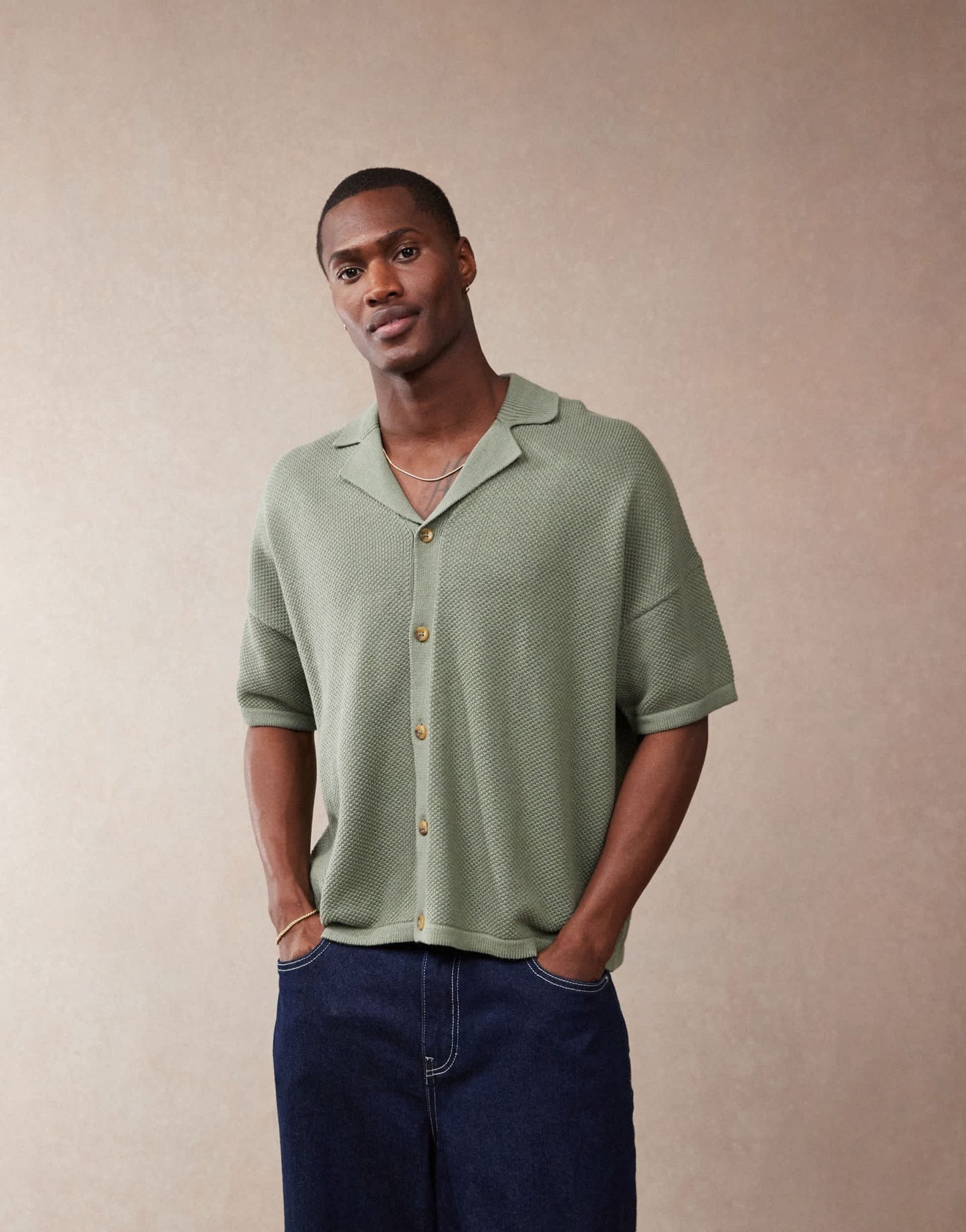 ASOS DESIGN oversized fit knitted texture revere neck button through polo in green - ASOS Sample Sale EU Store