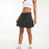 Falda mini plisada ASOS DESIGN en negro lavado