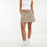 Falda mini plisada ASOS DESIGN en arena lavado