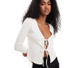 ASOS DESIGN texture tie front top with flute sleeve in cream