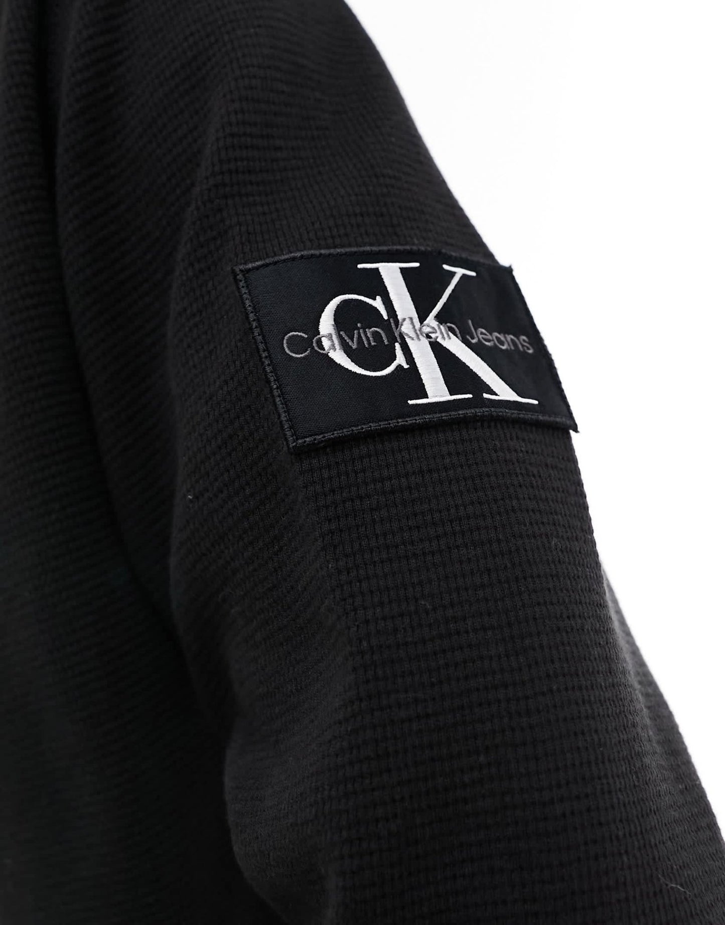 Calvin Klein Jeans waffle long sleeve badge logo polo shirt in black - ASOS Sample Sale EU Store
