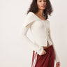 Cárdigan de punto acanalado con cremallera frontal y cuello off shoulder Gina Tricot en crema