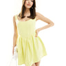 Vestido mini línea A con detalle de corsé de crepé premium exclusivo Heiress Beverly Hills en amarillo claro