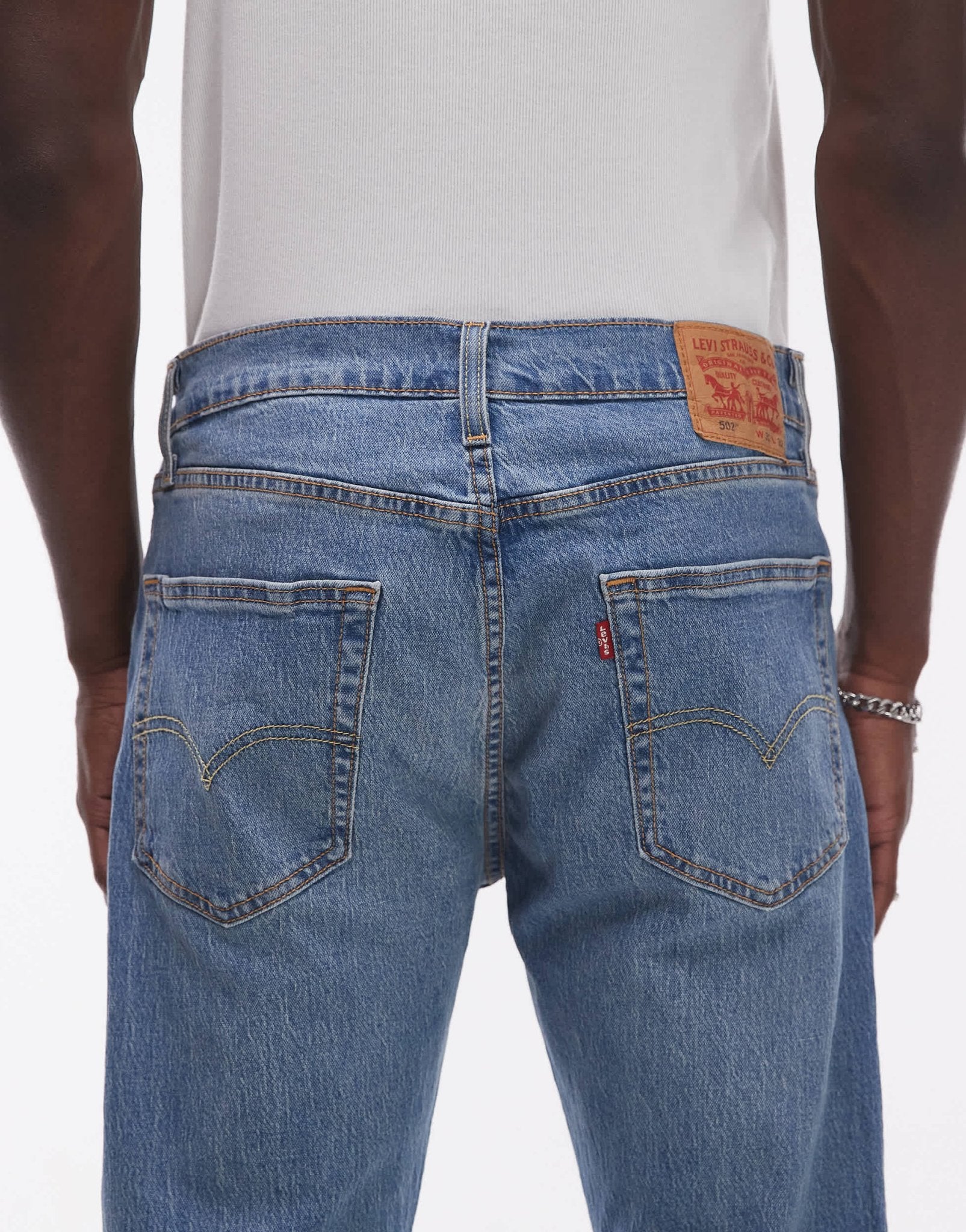 Levi's 502 tapered fit performance cool denim jeans in mid blue - ASOS Sample Sale EU Store