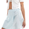 Monki mini wrap skirt with tie up side in blue ditsy floral print