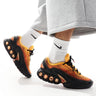 Nike Air Max DN trainers in black and orange