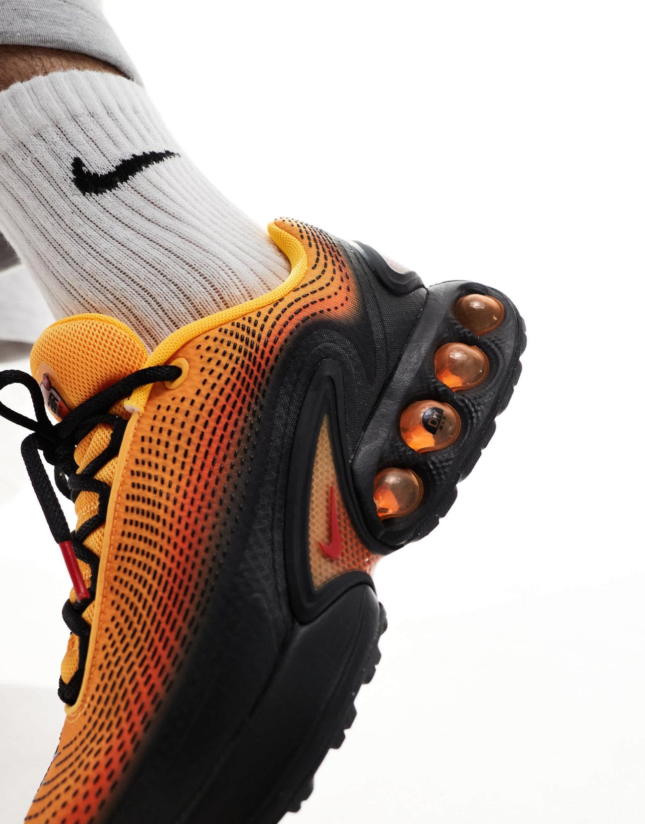 Nike Air Max DN trainers in black and orange - ASOS Sample Sale EU Store