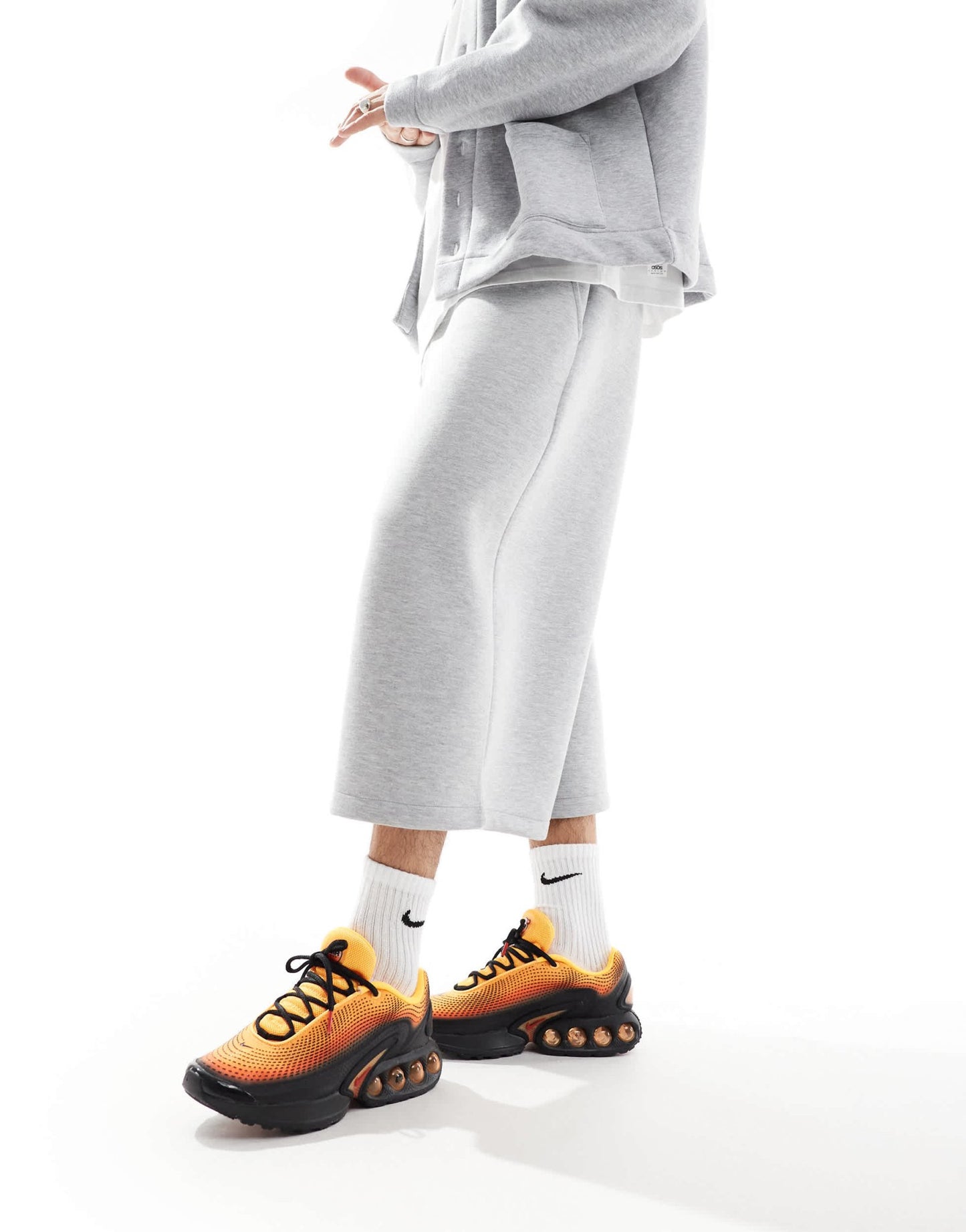 Nike Air Max DN trainers in black and orange - ASOS Sample Sale EU Store
