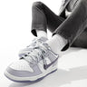 Baskets Nike Dunk Low Retro en blanc et gris