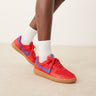 Nike Field General trainers in red and blue