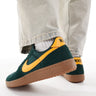 Nike Field general trainers trainers in green and gold