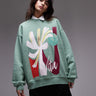 Topshop oversized washed sweatshirt with abstract graphic in green